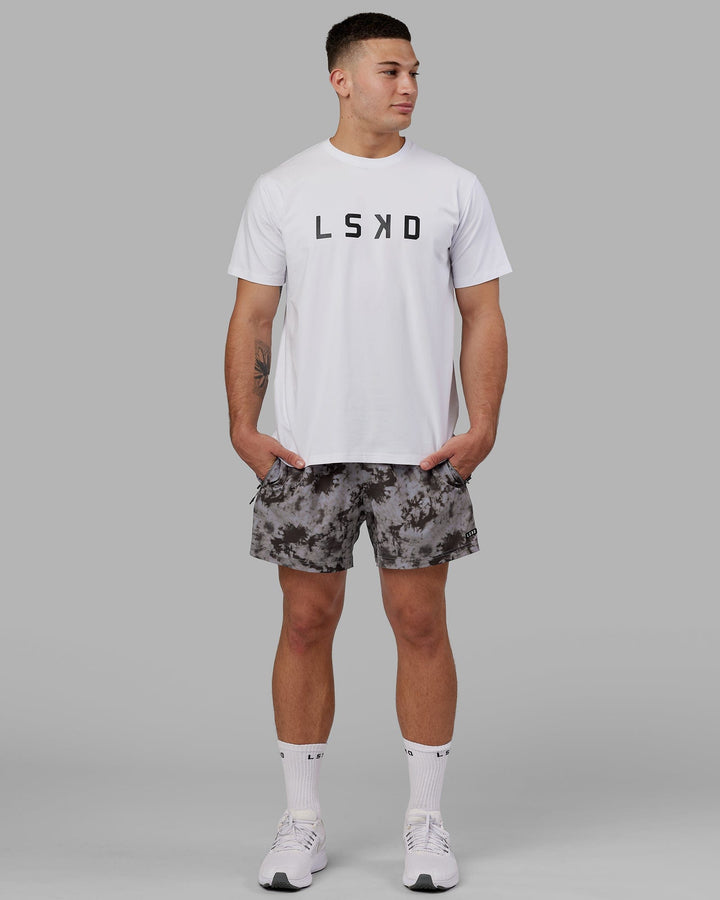 Man wearing Rep 5" Performance Short - Asphalt Tie Dye