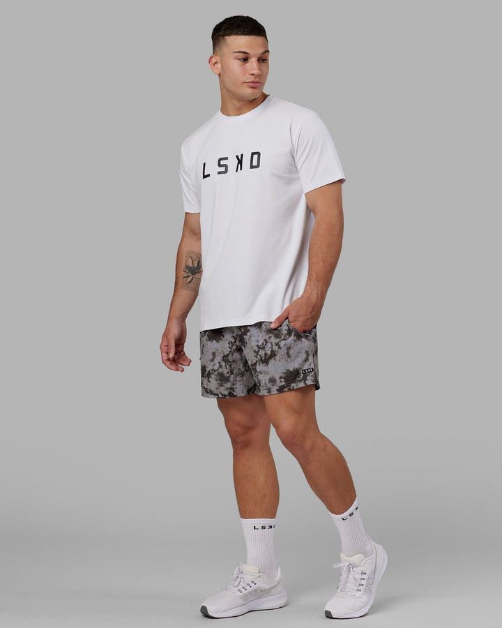 Man wearing Rep 5" Performance Short - Asphalt Tie Dye