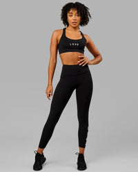 Woman wearing Rep Ultra High-Rise 7/8 Legging Pockets - Black-White | Model:Isabella | Size:S