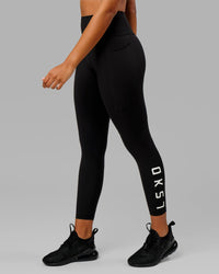 Woman wearing Rep Ultra High-Rise 7/8 Legging Pockets - Black-White | Model:Isabella | Size:S