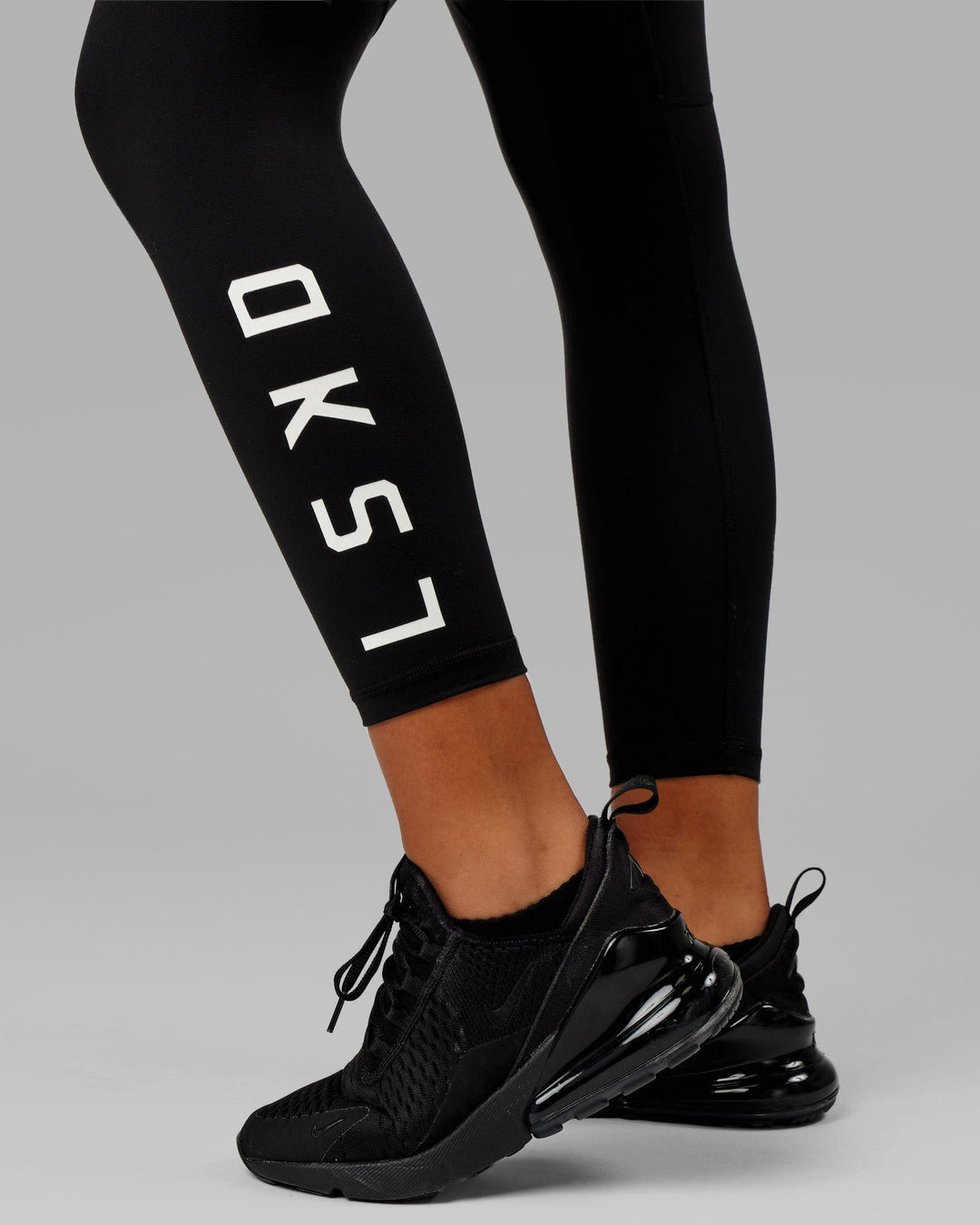 Woman wearing Rep Ultra High-Rise 7/8 Legging Pockets - Black-White | Model:Isabella | Size:S
