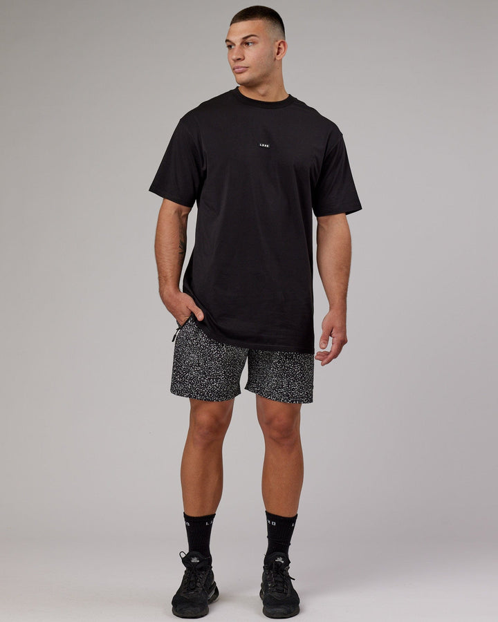 Man wearing Rep 7'' Performance Short - Black Spotty