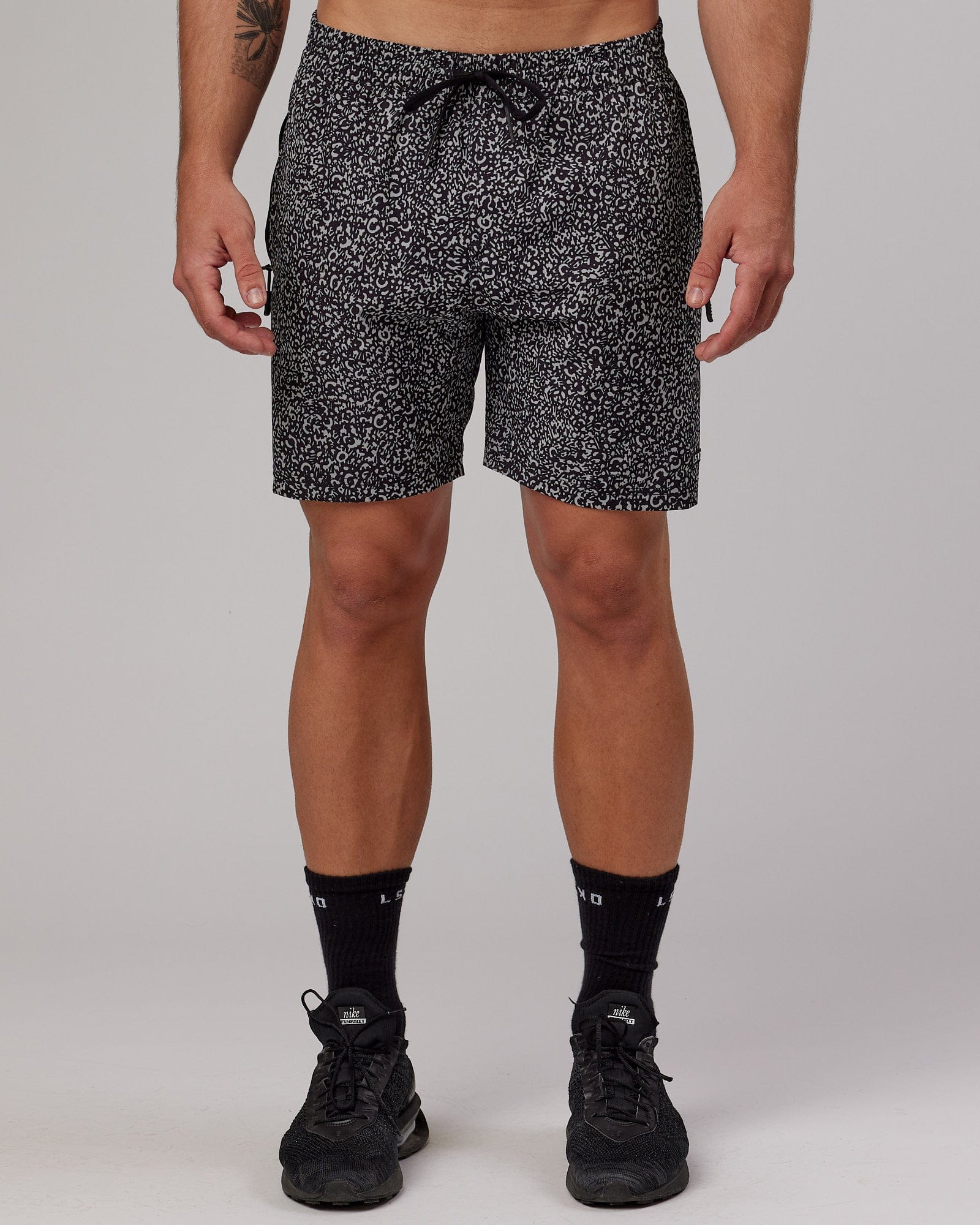 Man wearing Rep 7'' Performance Short - Black Spotty