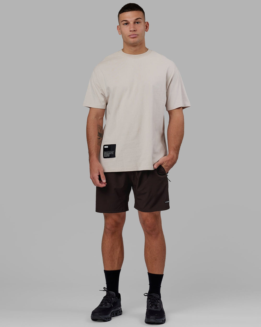 Man wearing Rep 7'' Performance Short - Dark Walnut