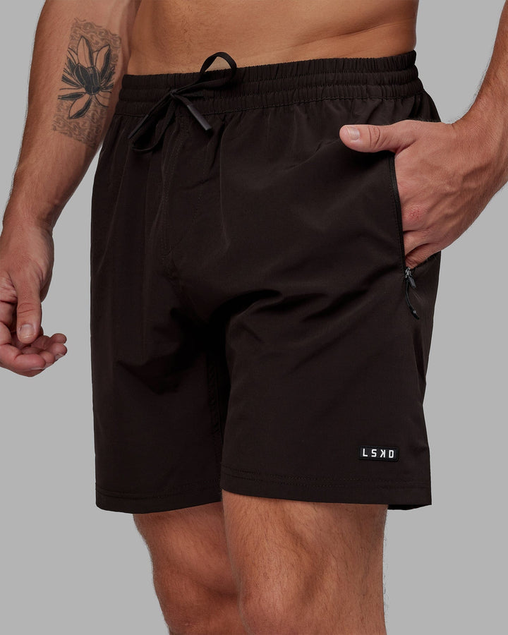 Man wearing Rep 7'' Performance Short - Dark Walnut