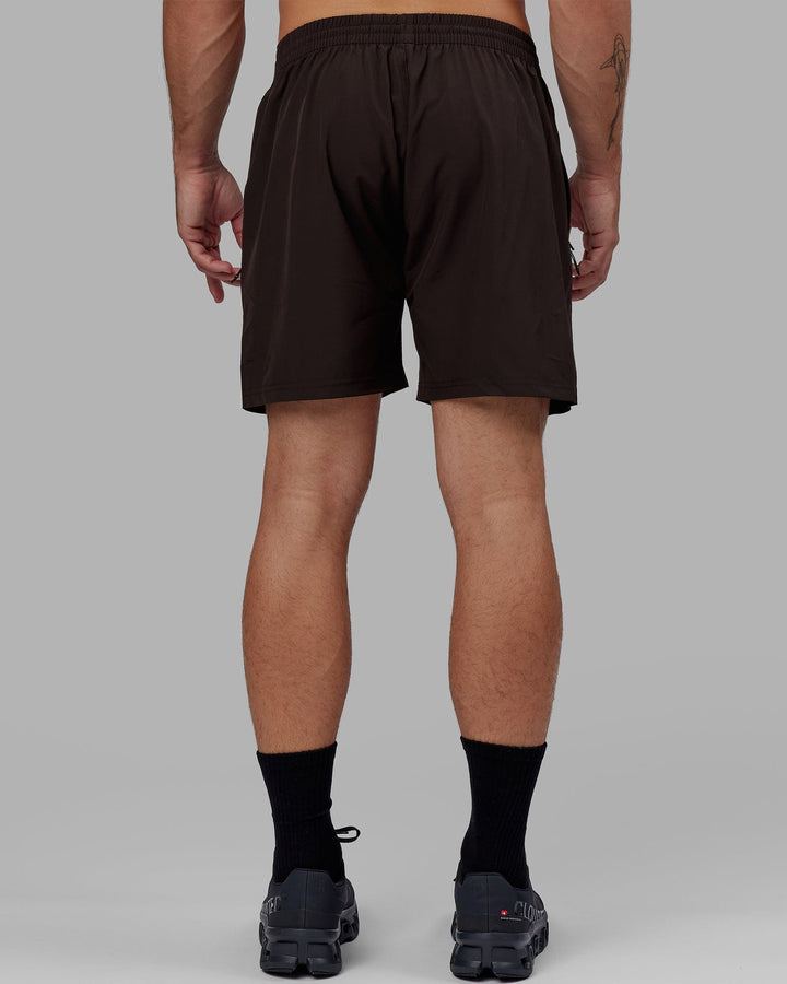 Man wearing Rep 7'' Performance Short - Dark Walnut