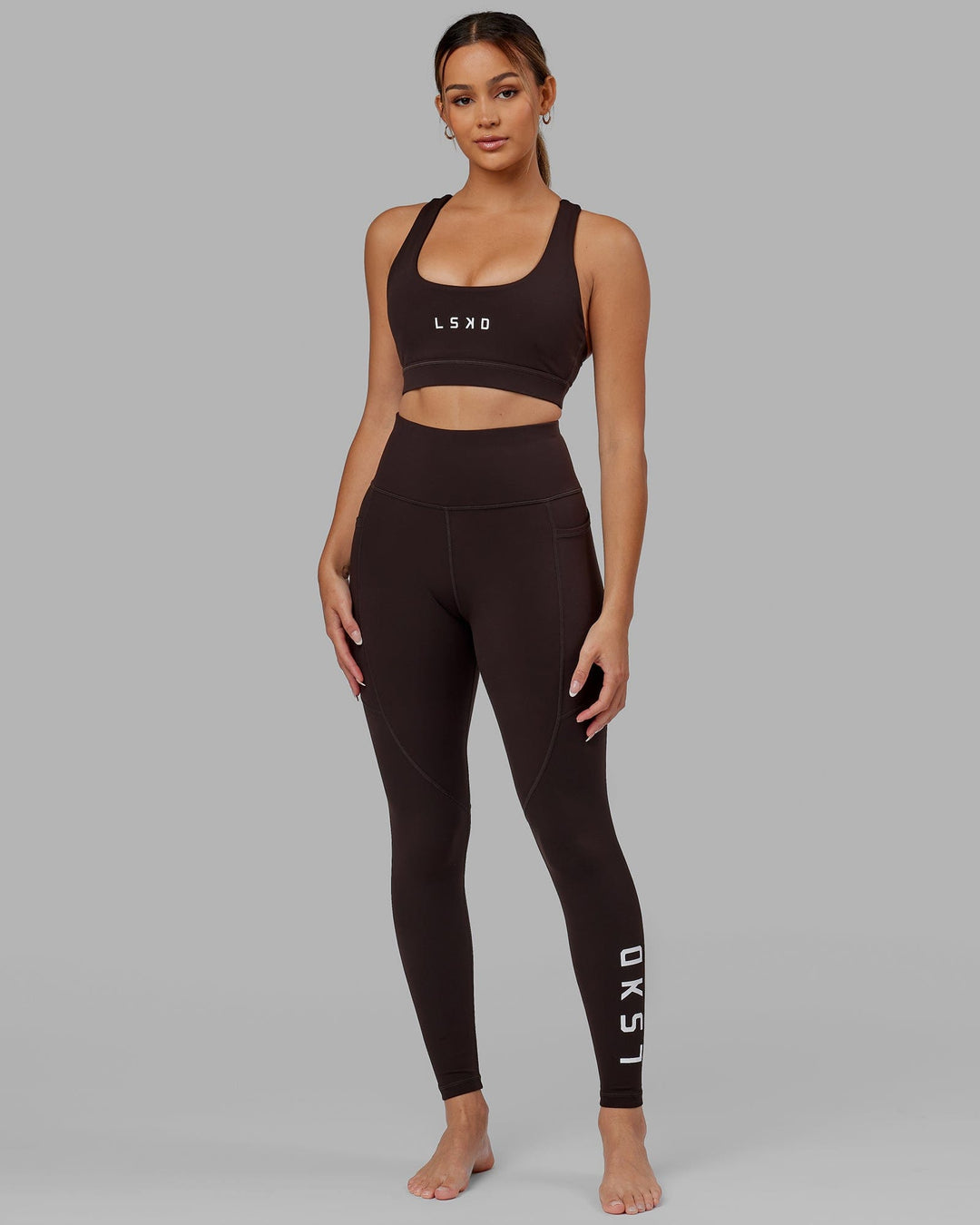 Woman wearing Rep Ultra High-Rise Full Length Legging Pockets - Dark Walnut | Model:Catalina | Size:S