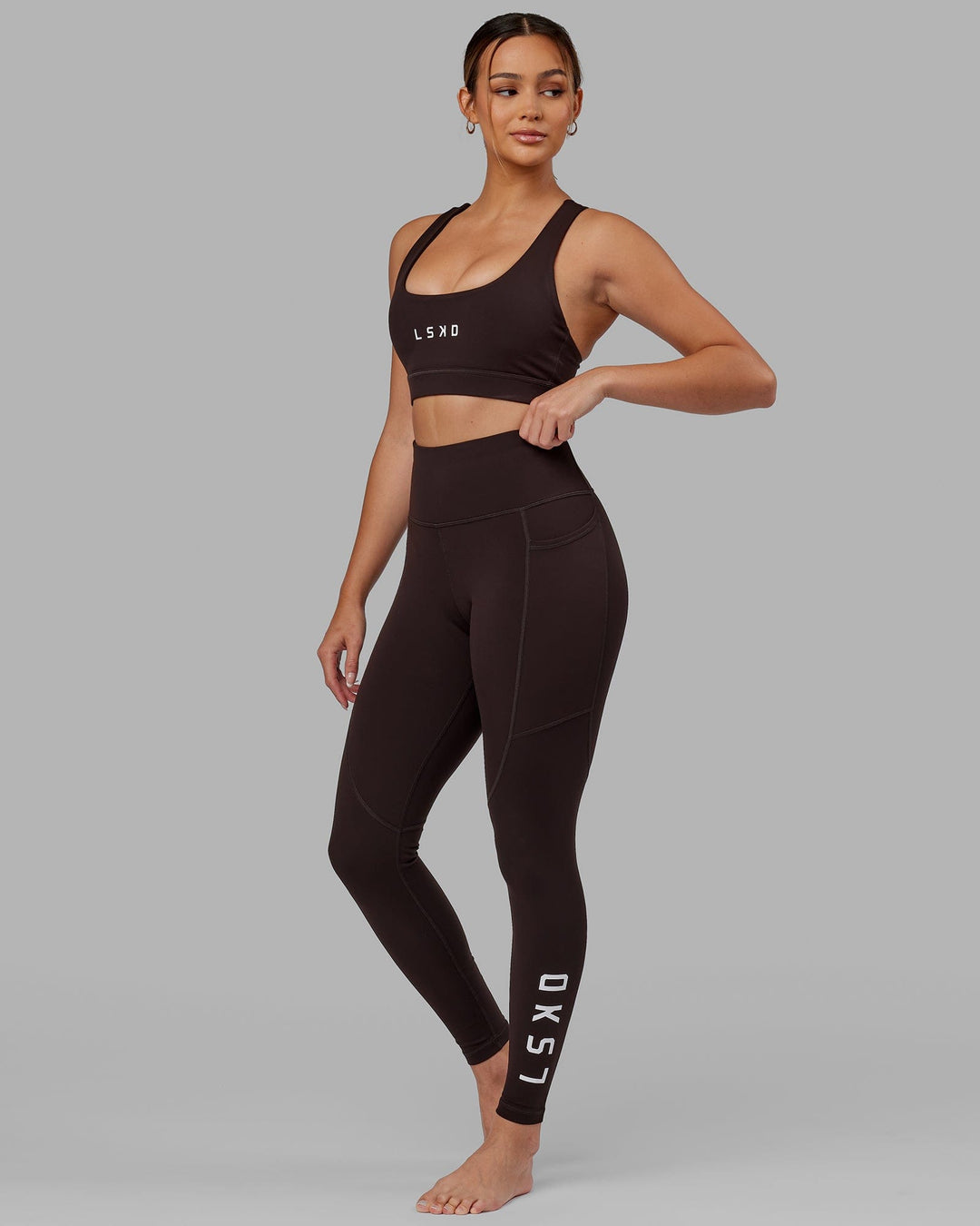 Woman wearing Rep Ultra High-Rise Full Length Legging Pockets - Dark Walnut | Model:Catalina | Size:S