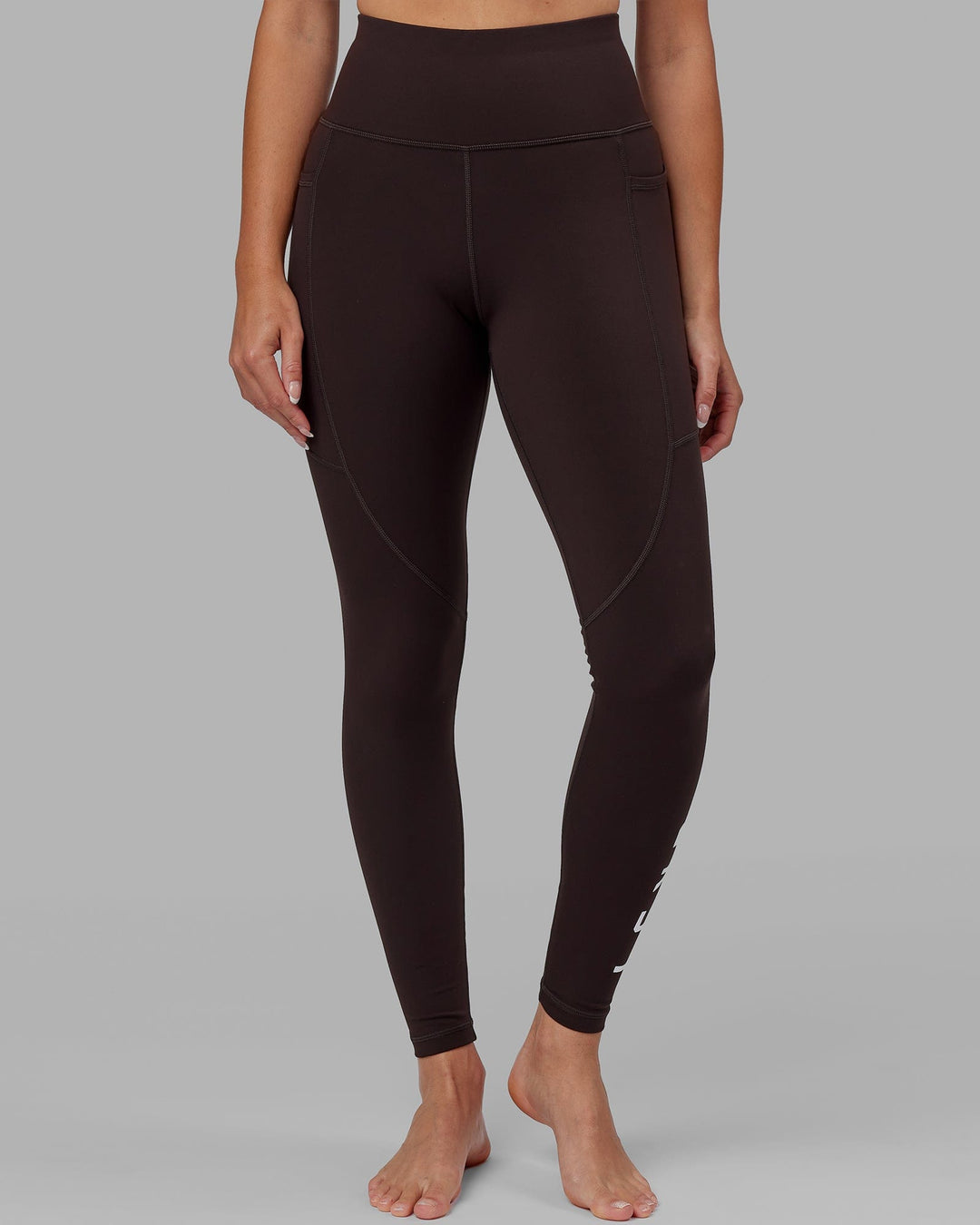 Woman wearing Rep Ultra High-Rise Full Length Legging Pockets - Dark Walnut | Model:Catalina | Size:S