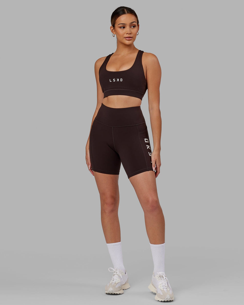 Woman wearing Rep Mid Short Tight - Dark Walnut