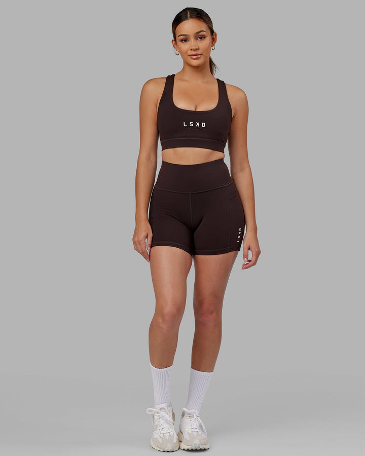 Woman wearing Rep Sports Bra Small Logo - Dark Walnut
