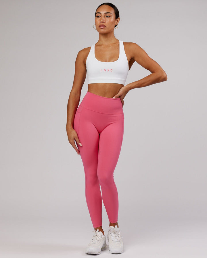 Woman wearing Rep Sports Bra Small Logo - White-Flamingo