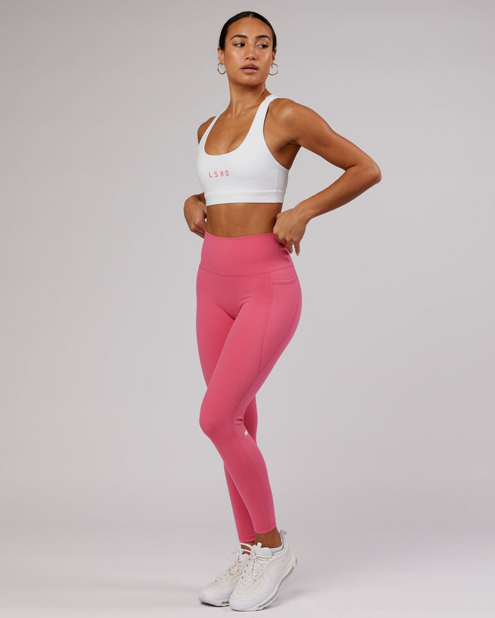 Woman wearing Rep Sports Bra Small Logo - White-Flamingo