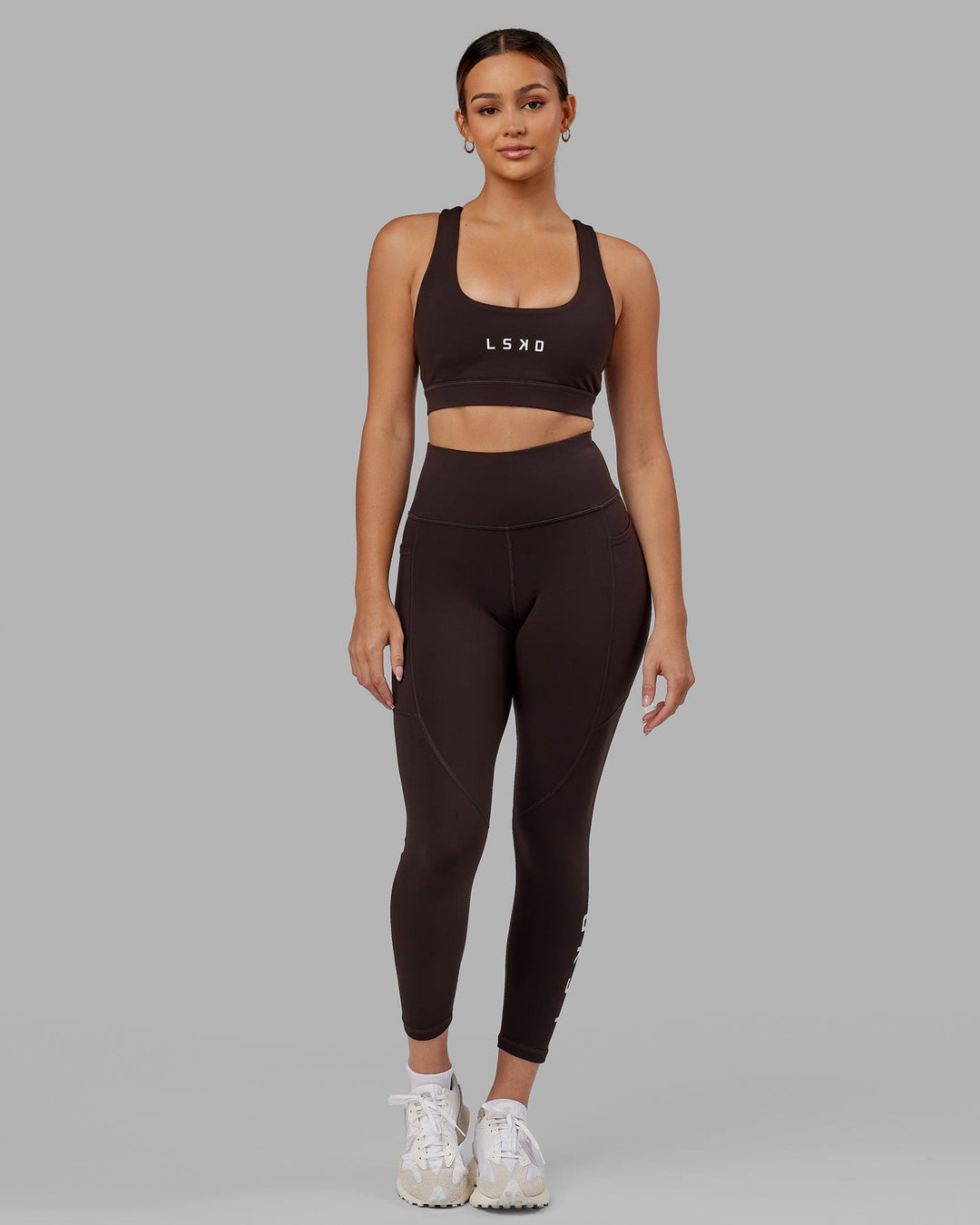 Woman wearing Rep Ultra High-Rise 7/8 Legging Pockets - Dark Walnut | Model:Catalina | Size:S