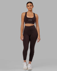 Woman wearing Rep Ultra High-Rise 7/8 Legging Pockets - Dark Walnut | Model:Catalina | Size:S