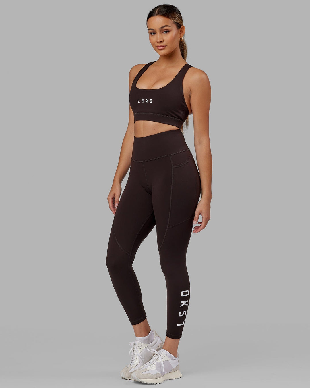 Woman wearing Rep Ultra High-Rise 7/8 Legging Pockets - Dark Walnut | Model:Catalina | Size:S