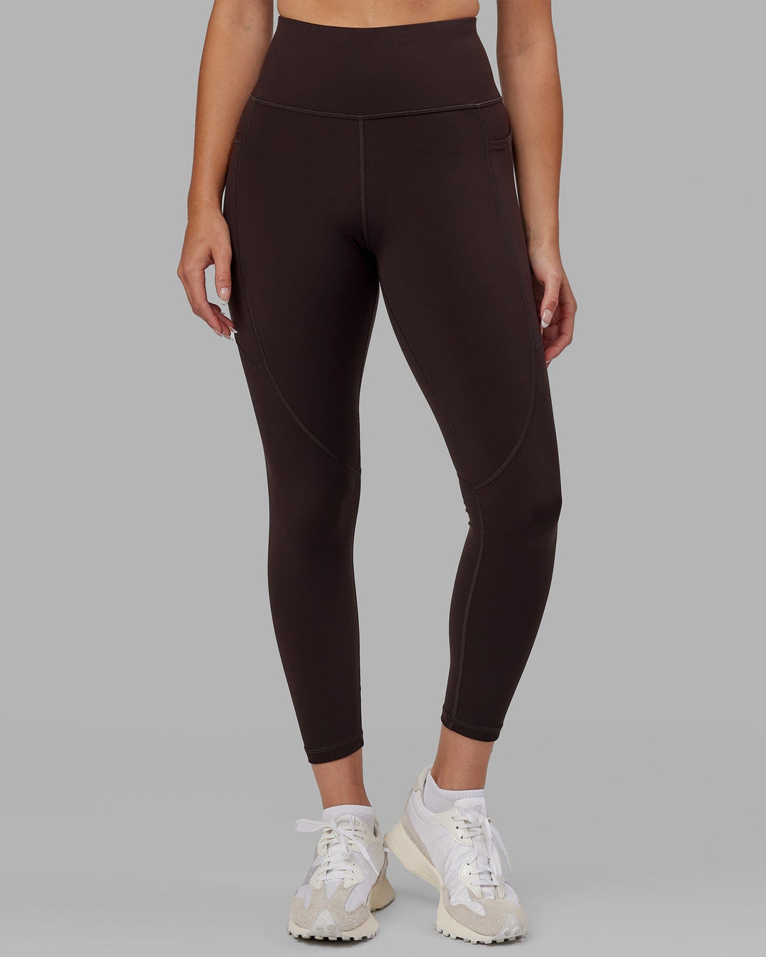 Woman wearing Rep Ultra High-Rise 7/8 Legging Pockets - Dark Walnut | Model:Catalina | Size:S