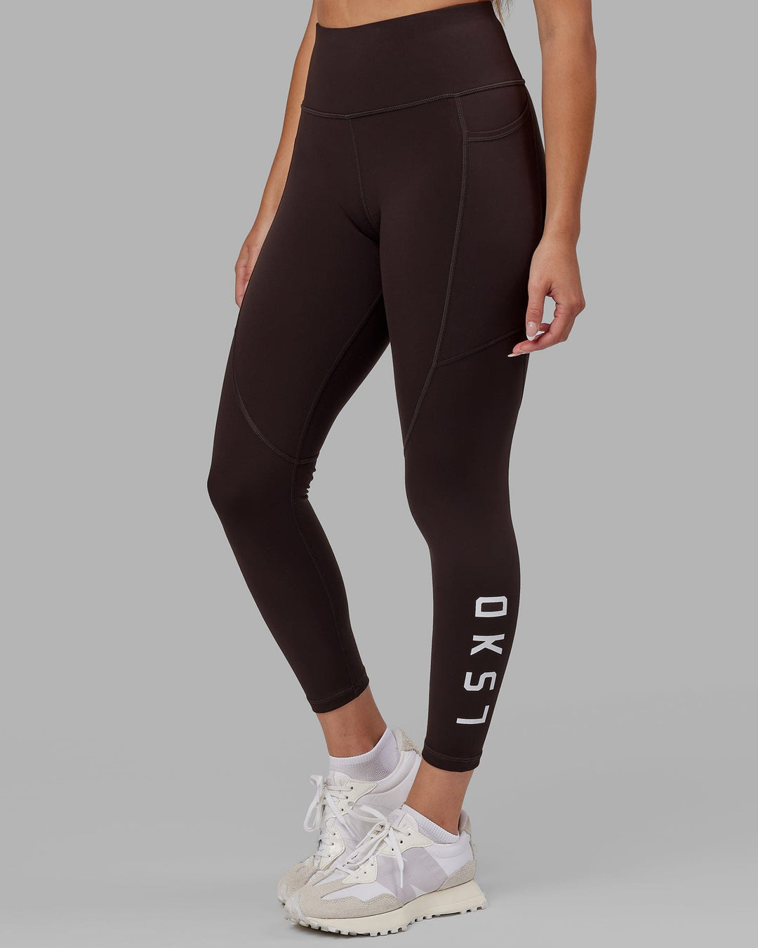 Woman wearing Rep Ultra High-Rise 7/8 Legging Pockets - Dark Walnut | Model:Catalina | Size:S
