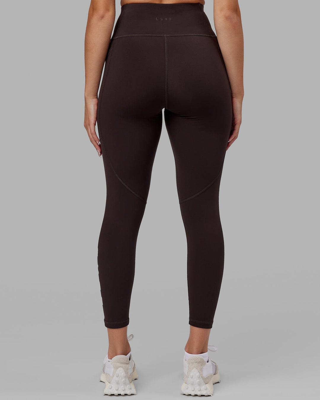 Woman wearing Rep Ultra High-Rise 7/8 Legging Pockets - Dark Walnut | Model:Catalina | Size:S