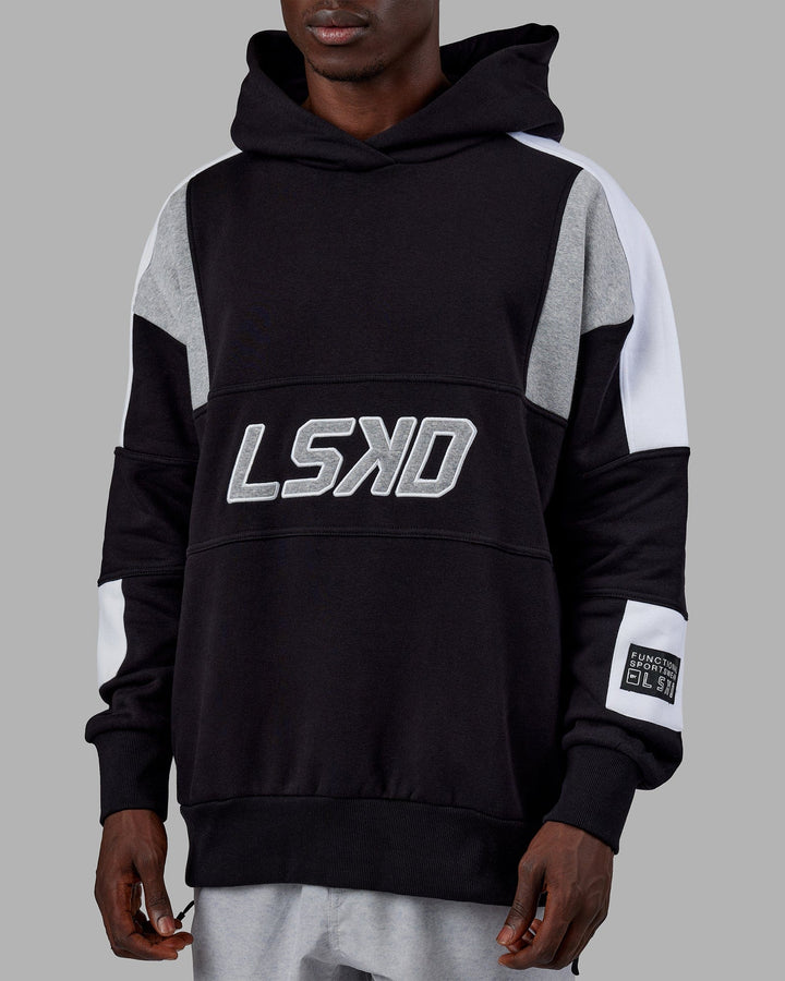 Man wearing Unisex Slam Hoodie Oversize - Black-Lt Grey Marl