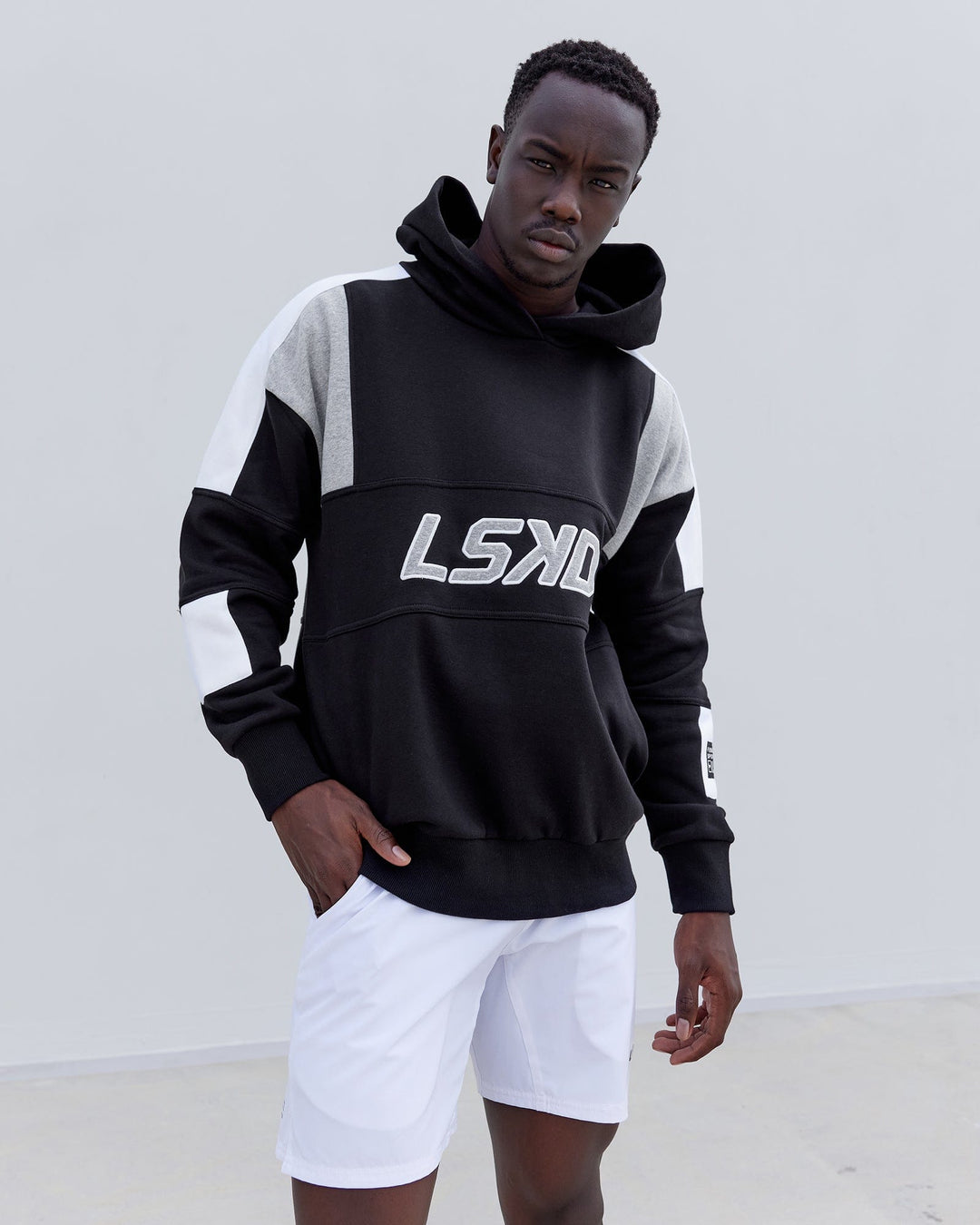 Man wearing Unisex Slam Hoodie Oversize - Black-Lt Grey Marl