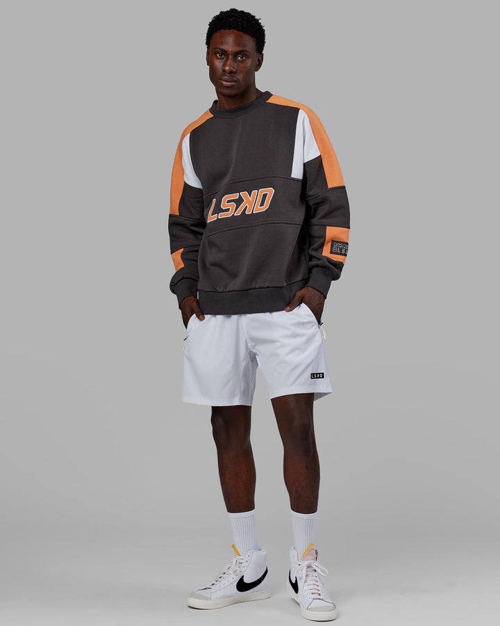 Man wearing Unisex Slam Sweater Oversize - Asphalt-Tangerine