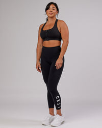 Woman wearing Sprint Sports Bra - Black