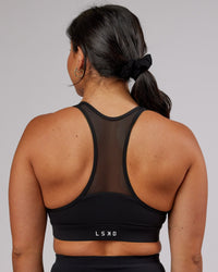 Woman wearing Sprint Sports Bra - Black