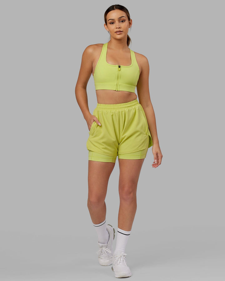 Woman wearing. Sprint Bra - Citrus Green
