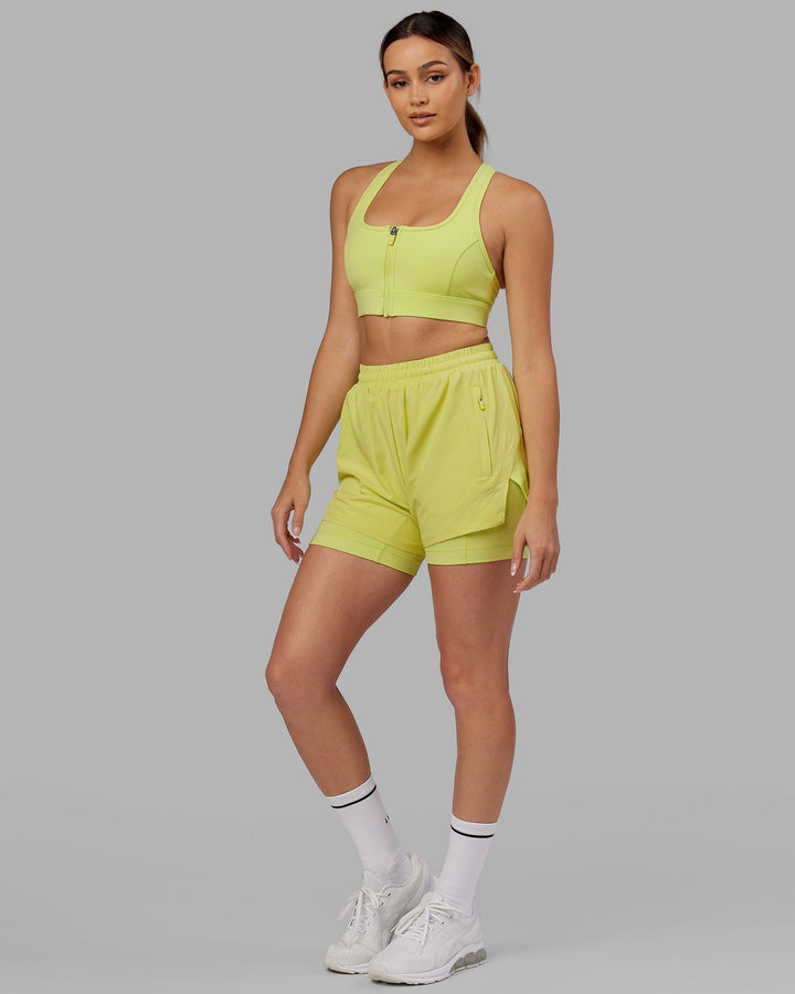 Woman wearing. Sprint Bra - Citrus Green