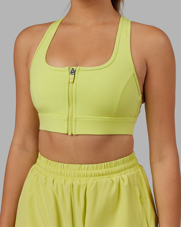 Woman wearing. Sprint Bra - Citrus Green