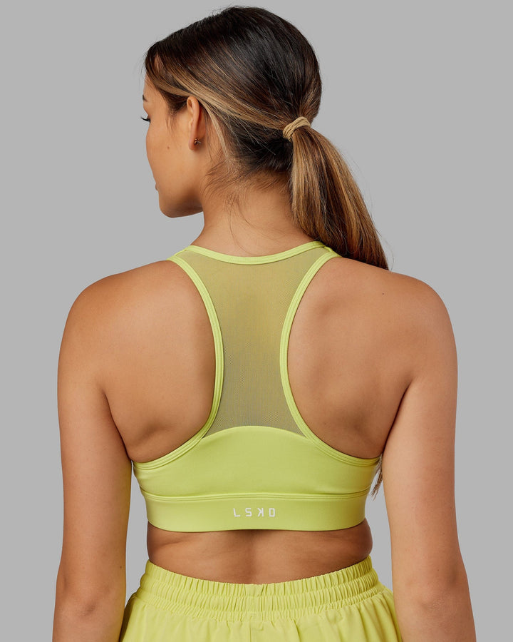 Woman wearing. Sprint Bra - Citrus Green