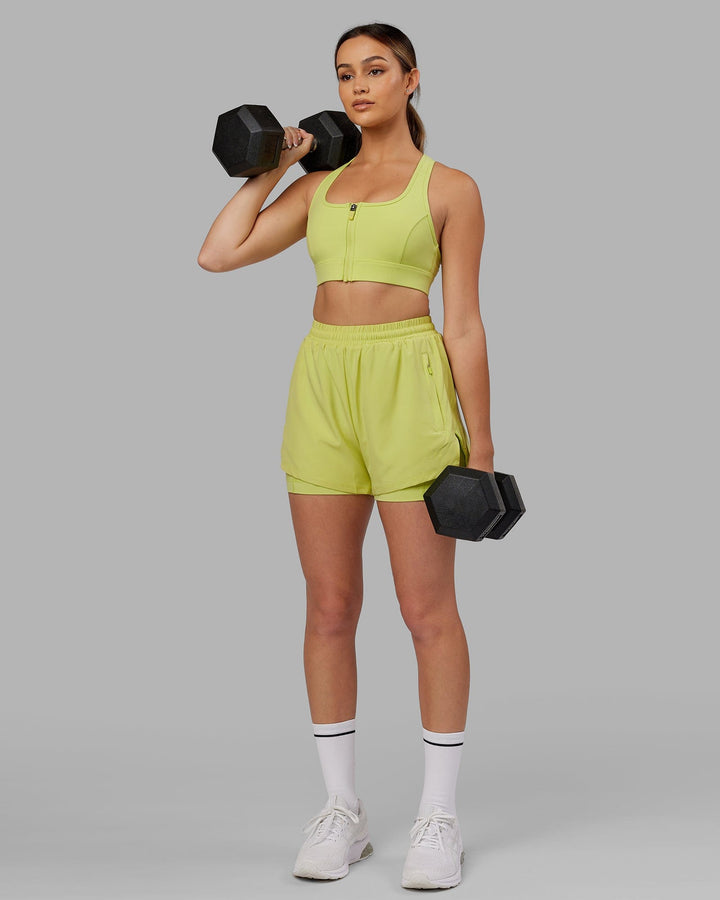 Woman wearing. Sprint Bra - Citrus Green