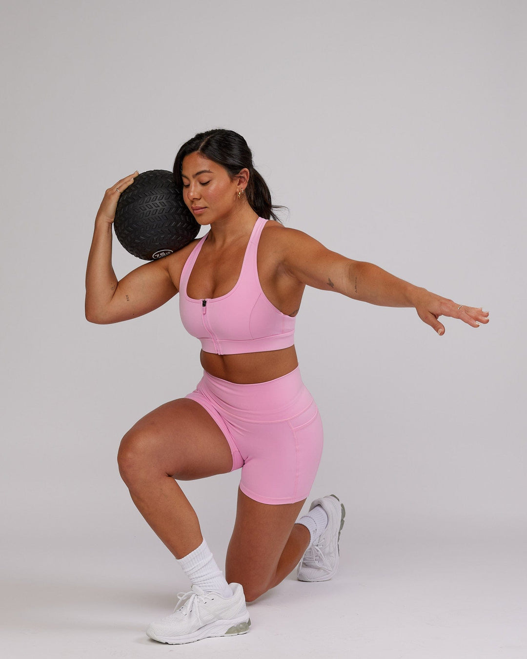 Woman wearing Sprint Sports Bra - Pink Frosting