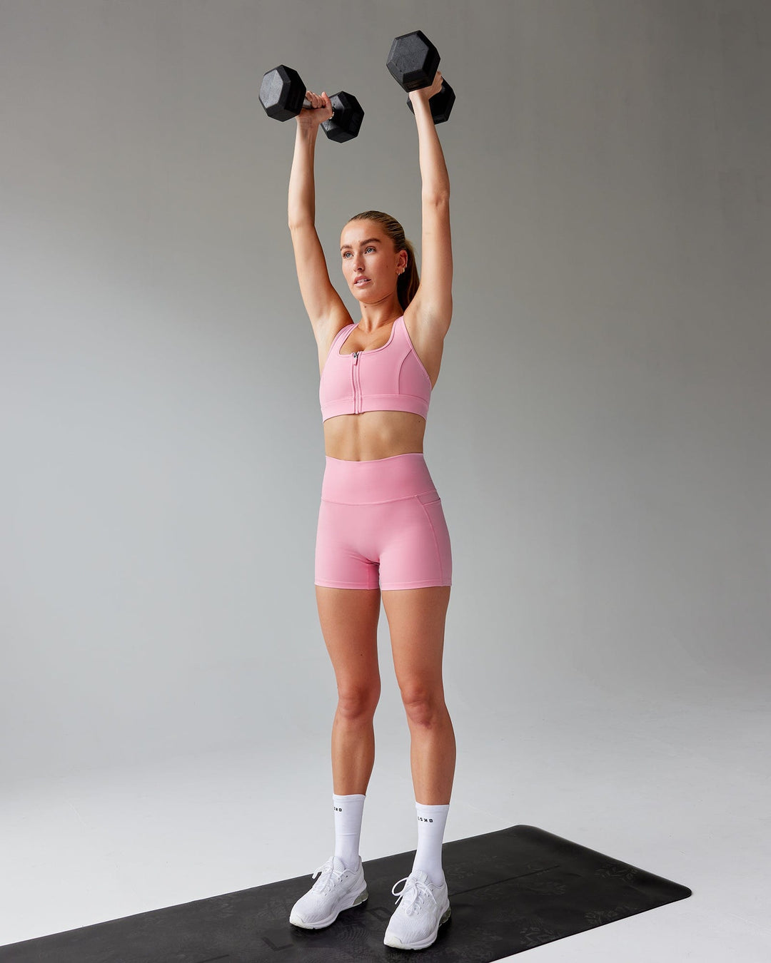 Woman wearing Sprint Sports Bra - Pink Frosting