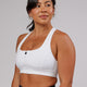 Woman wearing Sprint Sports Bra - White