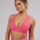 Woman wearing Stamina Sports Bra - Flamingo
