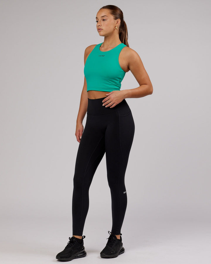 Woman wearing Status Shelf Bra Active Tank - Hyper Teal