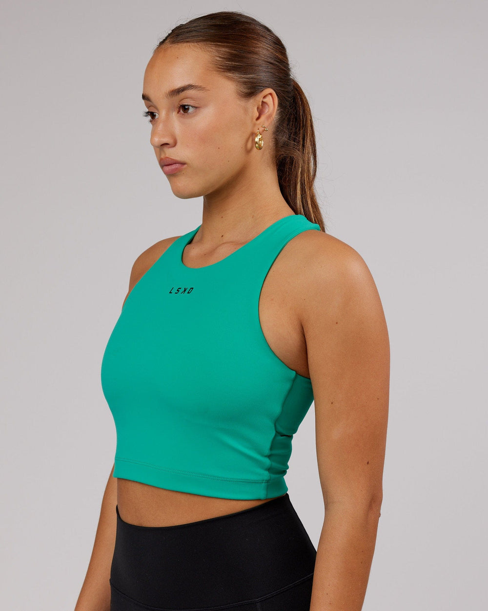 Woman wearing Status Shelf Bra Active Tank - Hyper Teal