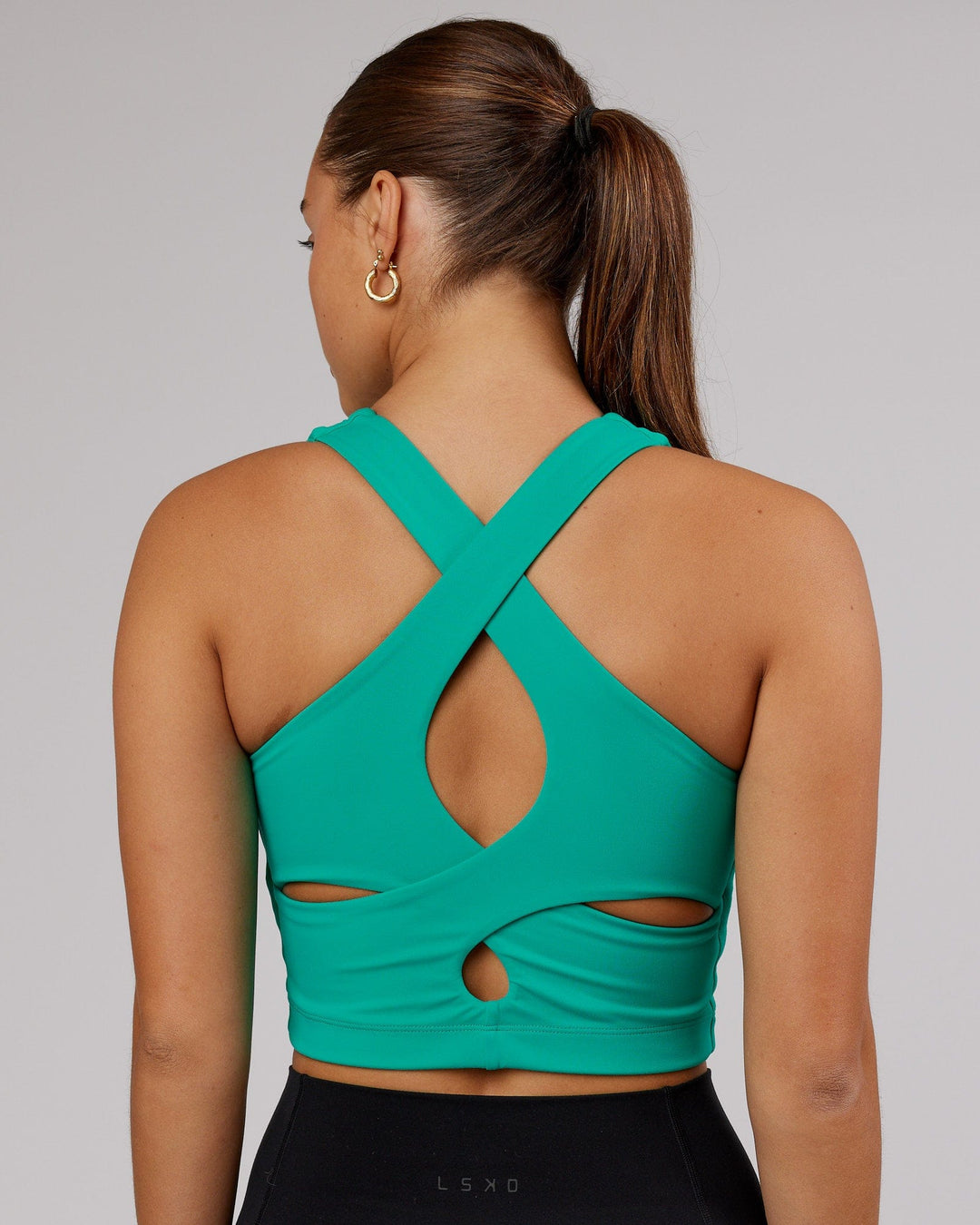 Woman wearing Status Shelf Bra Active Tank - Hyper Teal