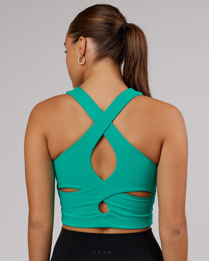 Woman wearing Status Shelf Bra Active Tank - Hyper Teal