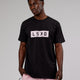 Man wearing Strength FLXCotton Tee - Black-Pink