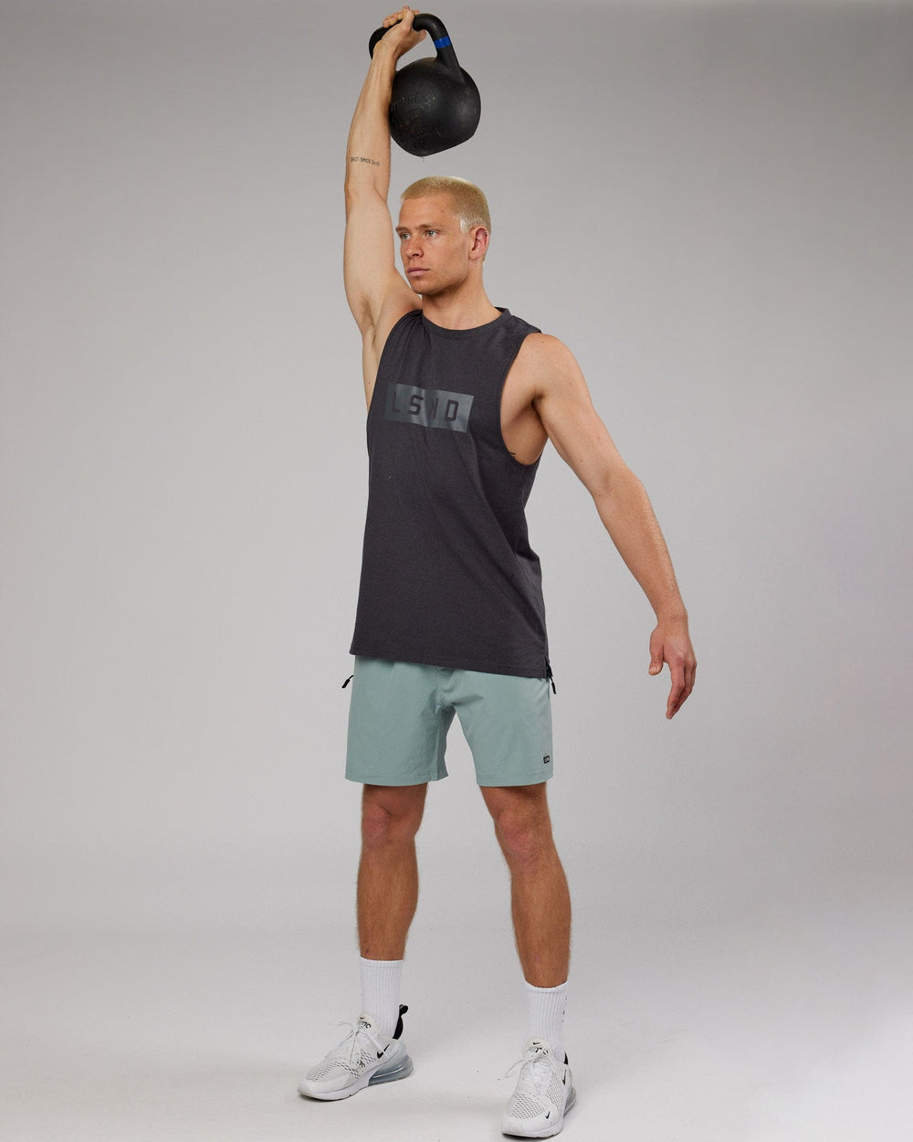 Man wearing Strength FLXDRY Training Fit Performance Tank - Asphalt
