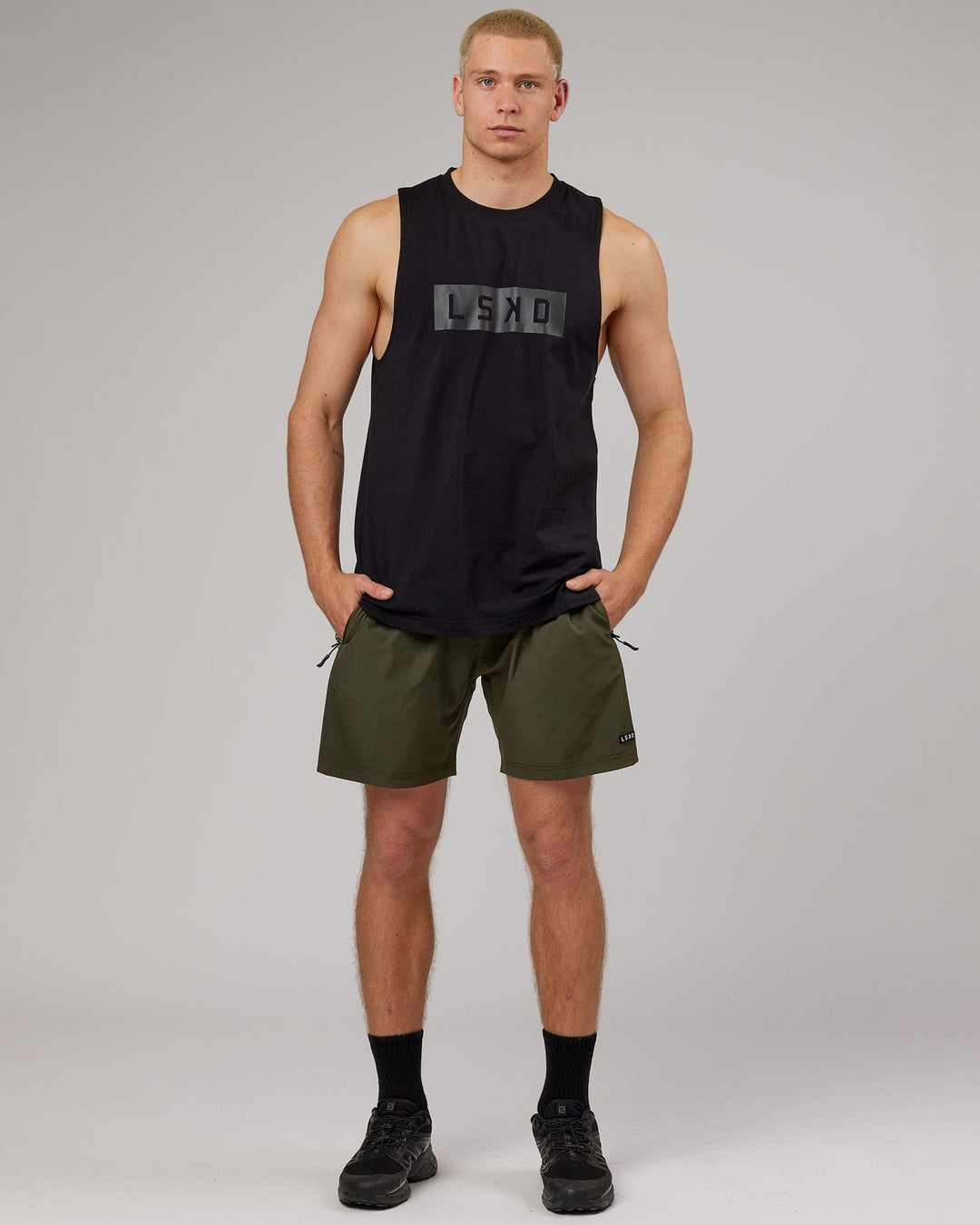 Man wearing Strength FLXDRY Training Fit Performance Tank - Black
