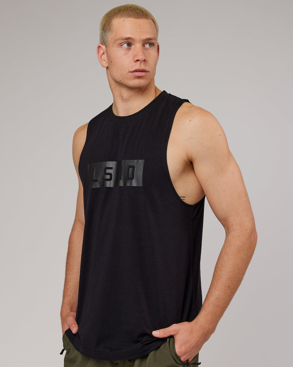 Man wearing Strength FLXDRY Training Fit Performance Tank - Black