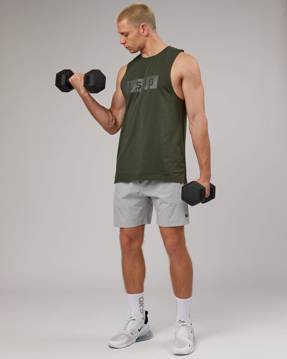 Man wearing Strength FLXDRY Performance Tank - Forest Night