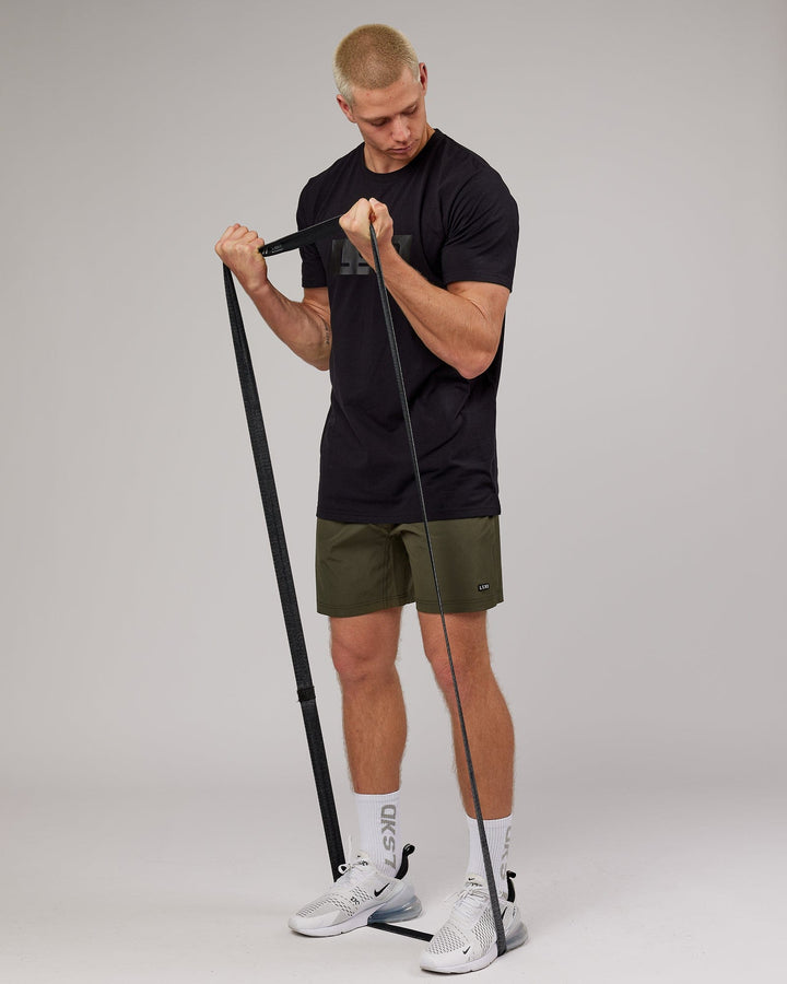 Man wearing Strength FLXDRY Performance Tee - Black-Black