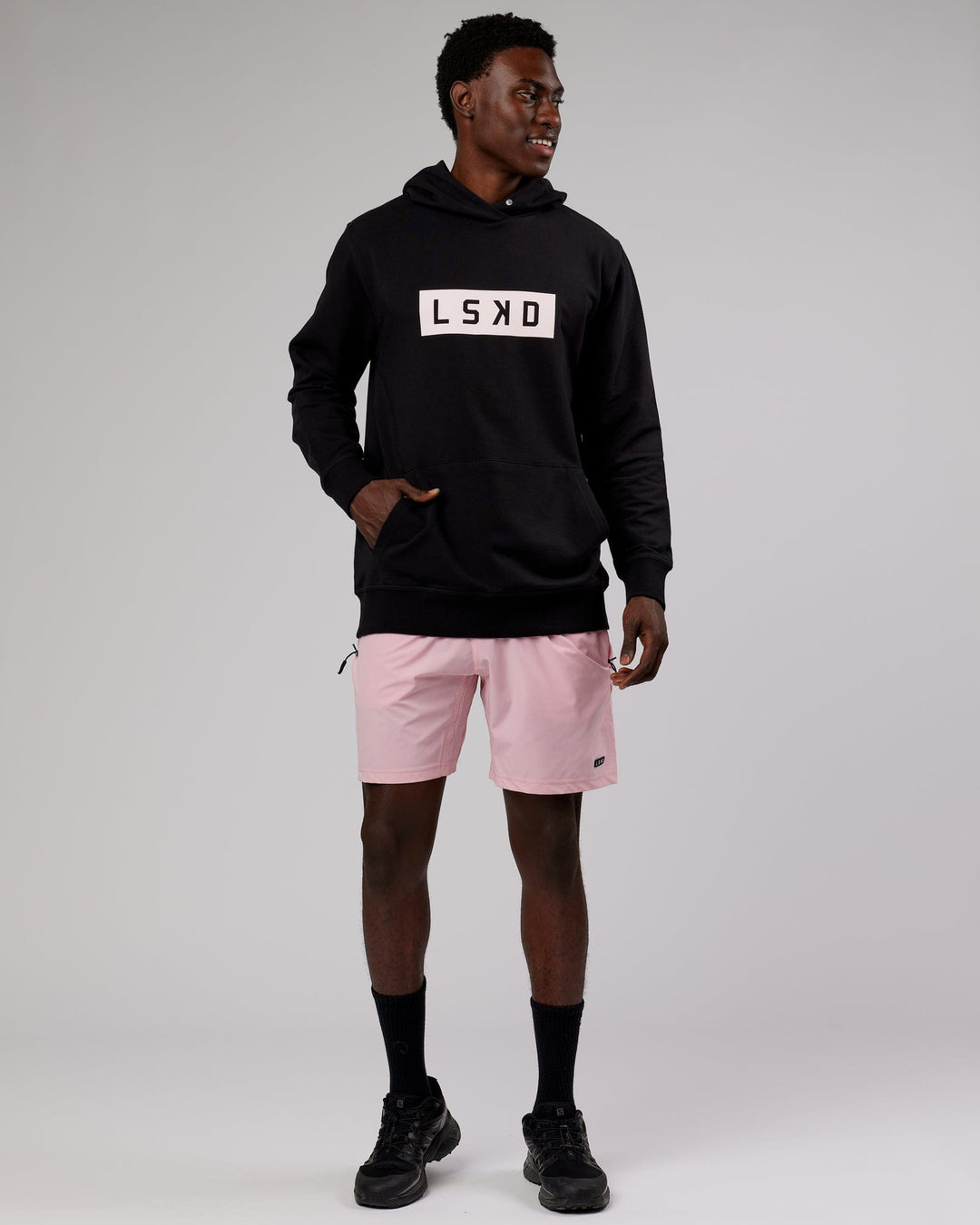 Man wearing Strength FLXFleece Pullover - Black-Pink