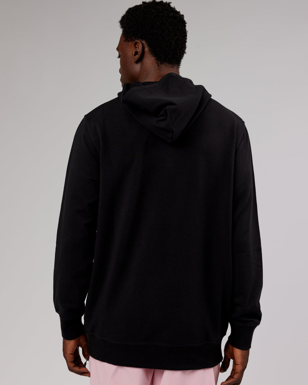 Man wearing Strength FLXFleece Pullover - Black-Pink