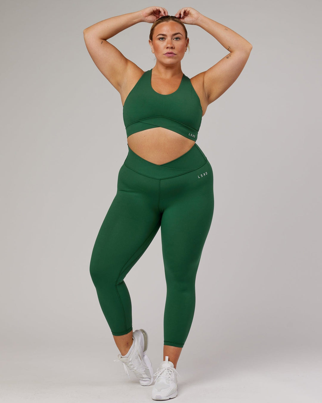 Woman wearing Strike 7/8 Length Tight - Pineneedle